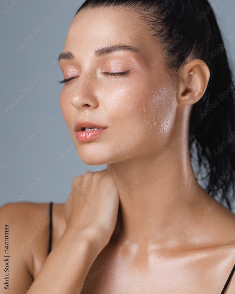 Obraz premium Relaxed Woman with Dewy Skin and Closed Eyes After Intense Workout