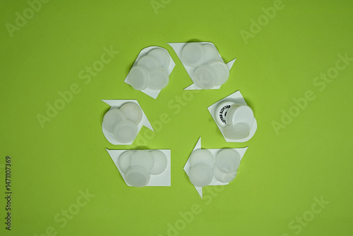 White Bottle Caps In Recycling Icon Design