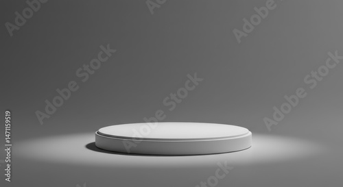 Isolated white round podium on a gray background with a spotlight effect