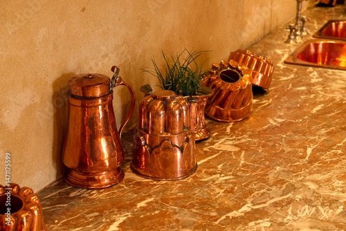 Mortree France - 7 September 2023 - Copper and brass pans and kitchen utensils in the kitchen of Château d'O in Montree France