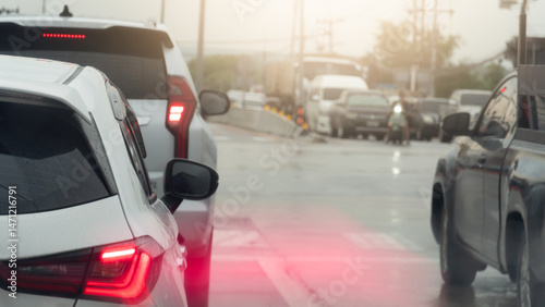 Wallpaper Mural Rear side of white car driving on the road. Motion of tail light of car.Traffic in the rainy time. Road with wet water of rain. Background of junction with many car stop by traffic light control. Torontodigital.ca