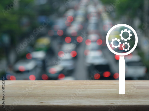 Seo flat icon on wooden table over blur of rush hour with cars and road, Search engine optimization concept