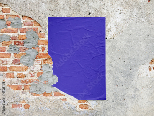 Vertical wrinkled purple poster mockup on a worn textured wall with exposed red bricks and cement patches. Urban grunge aesthetic ideal for design presentations or advertising mockups.