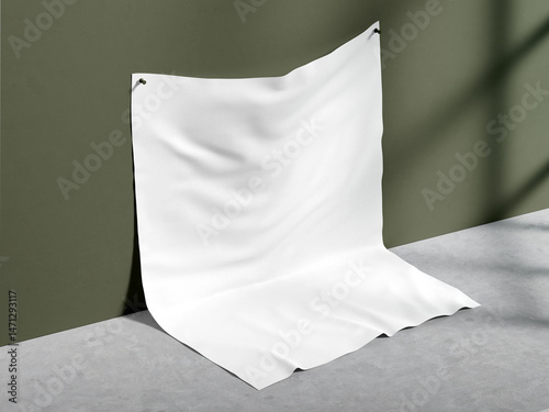 Minimal white fabric draped against an olive green wall and concrete floor, with soft shadows. Perfect for textile mockups, product presentation backgrounds, or branding design.

