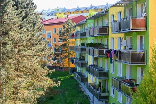 Facade of a modern apartment building with windows and balconies. Czech Republic - Europe.. Original prefabricated houses on a housing estate from the communist era in Eastern and Central Europe 