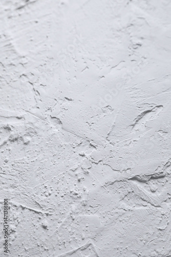 White acrylic illustration textured plaster. Drops, lines, arrows, cracks in close-up. Drawing with a spatula