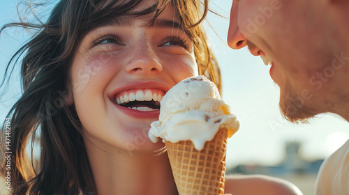 Close-up portrait of person joyfully eating vanilla ice cream cone in warm sunset light, showing genuine happiness and decorated face. Couple romantic moment during ice cream date