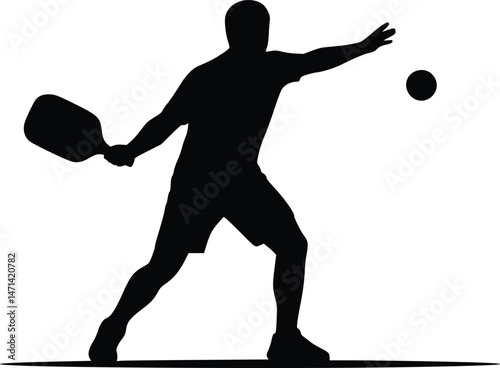 Silhouette of a pickleball player in action, swinging a paddle to hit the ball, highlighting movement and sports dynamics