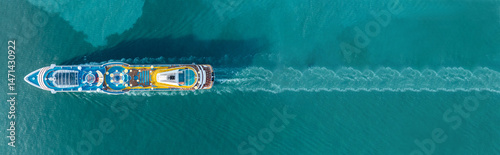Obraz na plátně Aerial top view of a luxury cruise ship sailing through deep blue ocean water