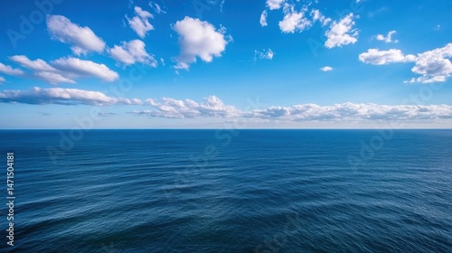 A panoramic view of a vast, deep blue ocean stretching to the horizon under a bright, sunny sky with fluffy white cumulus clouds. : Generative AI