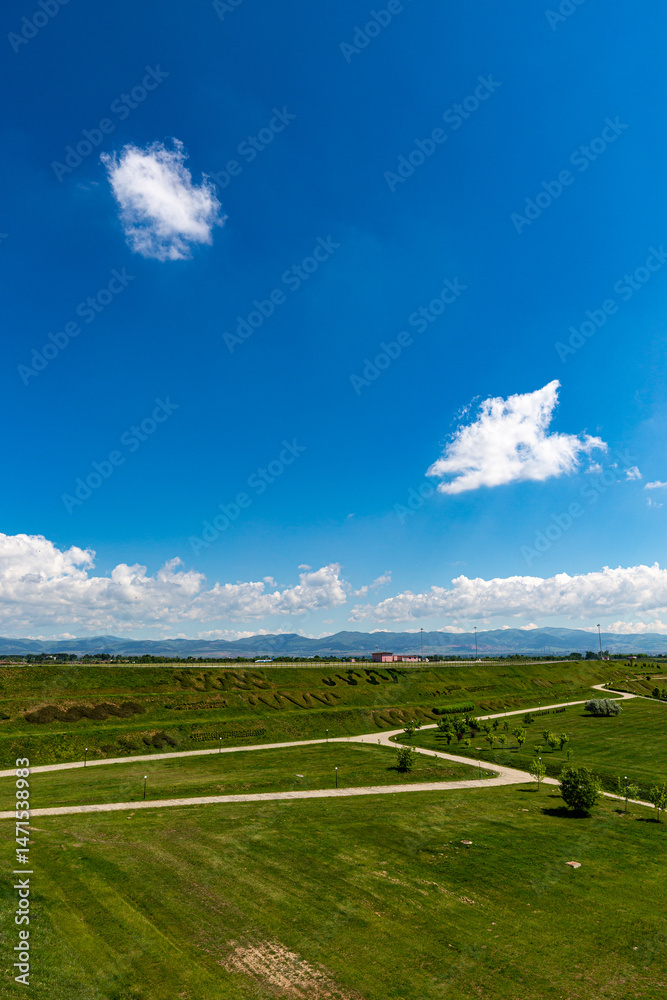Grass field and blue sky in sunny day