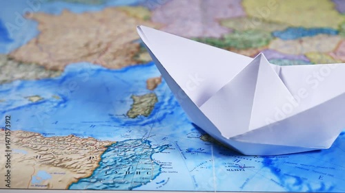 Paper Boat On A World Map
