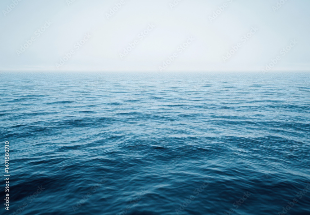 Fototapeta premium A serene, expansive view of a calm ocean under a hazy sky, showcasing the tranquil, deep blue water with subtle waves. : Generative AI
