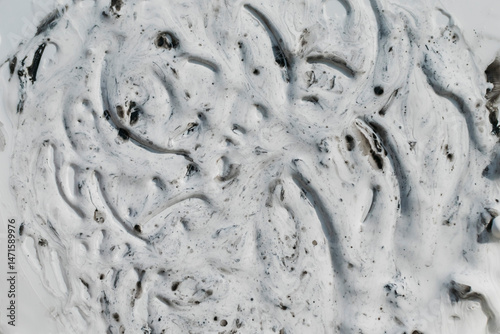 Streaks and drops of thick white paint
