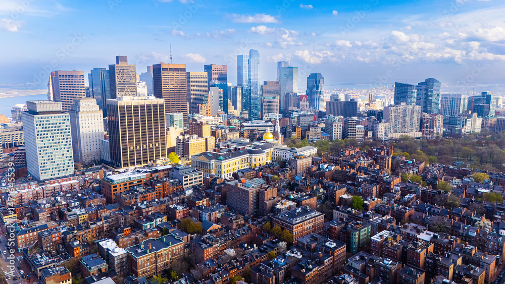 Fototapeta premium Orange brick houses along stunning skyscrapers. Varied scenery of Boston, Massachusetts, USA. Aerial view.
