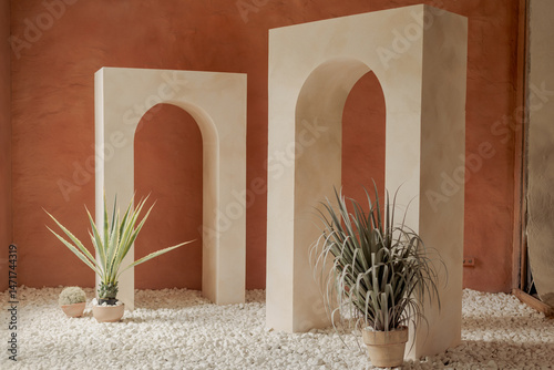 Minimalist Interior with Arches, Plants, and Natural Light