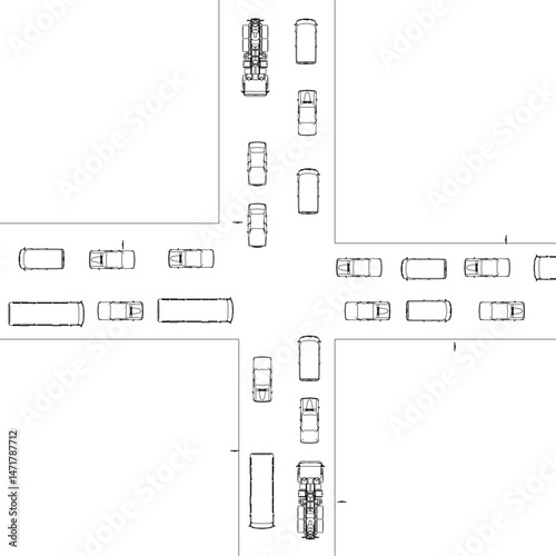 A crosswalk with a large number of cars and trucks. The cars are stopped at the intersection, and the trucks are driving through the intersection. Top view