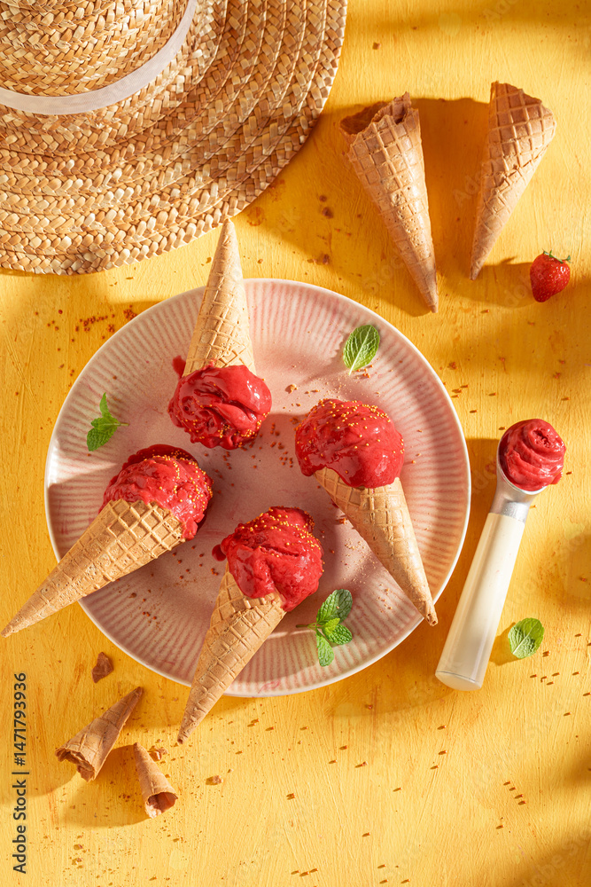 Sweet and cold strawberry ice cream as a creamy dessert.