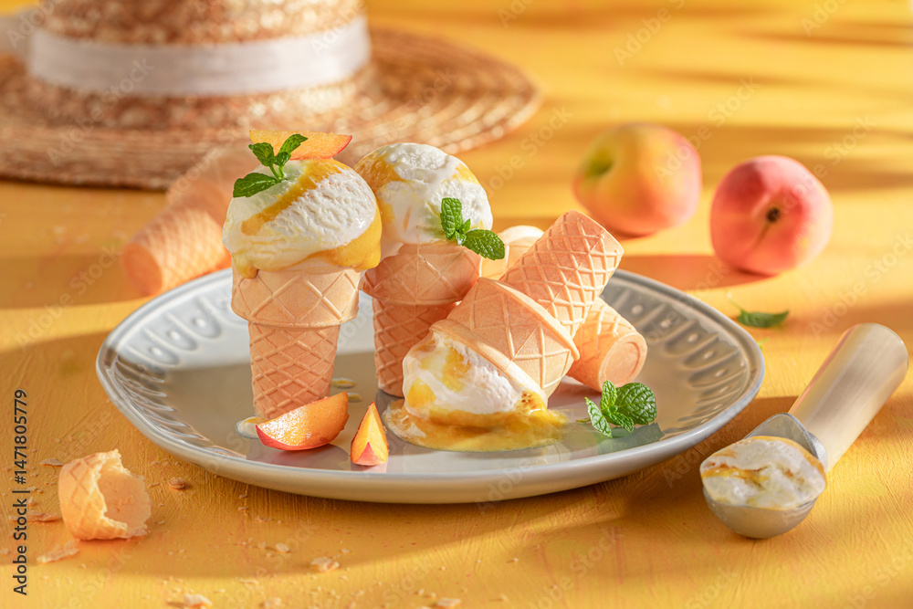 Sweet and homemade peach ice cream as a creamy dessert.