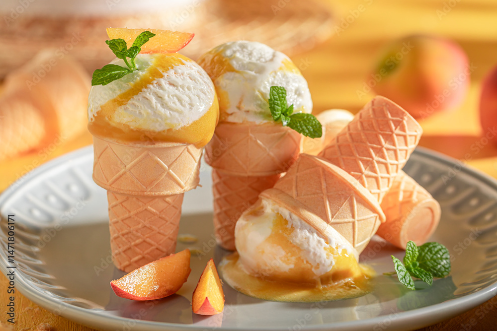 Homemade and tasty peach ice cream as a summer dessert.