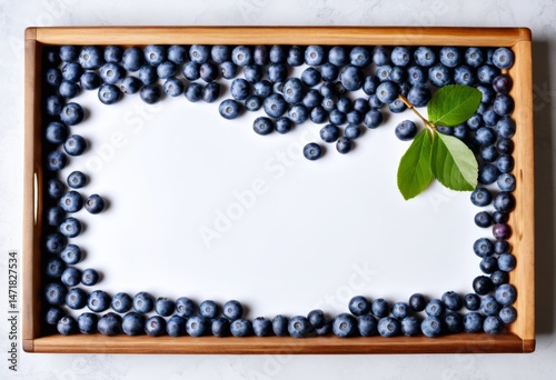 There is a wooden frame with blueberries inside