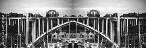 Artistic mirror of the bridge over river