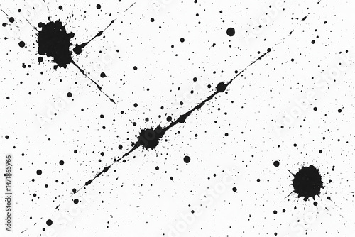 Abstract black ink splatters on a white background, creating an artistic and dynamic visual effect
