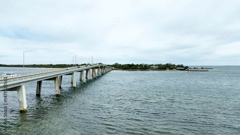 San Remo Bridge and the cars passing through it. The bridge that connects Phillip Island to the mainland in Victoria Australia. San Remo Bridge and the cars passing through it. The bridge that connects Phillip Island to the mainland in Victoria Australia.