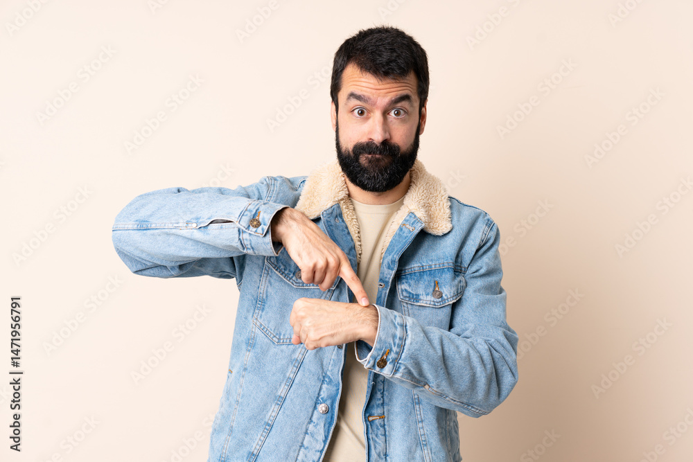 Fototapeta premium Caucasian man with beard over isolated background making the gesture of being late