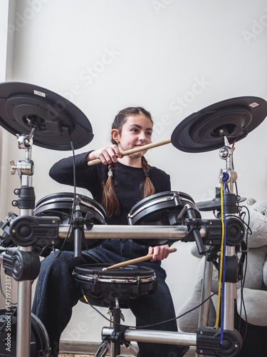Rock Beat in Motion Female Drummer in Action photo