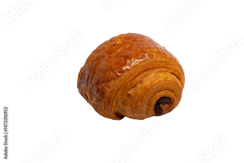 A glossy, golden-brown pain au chocolat, filled with dark chocolate, is isolated against a stark white background.