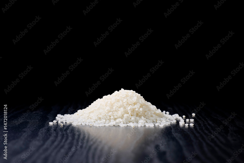 Raw Japanese rice served on a black background Raw Japanese rice served on a black background