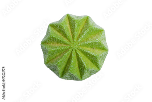 A distinct green confection, possibly a frozen dessert or a cake, featuring a unique pleated and textured surface