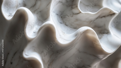 Macro image of hand-polished marble statue with soft curves.