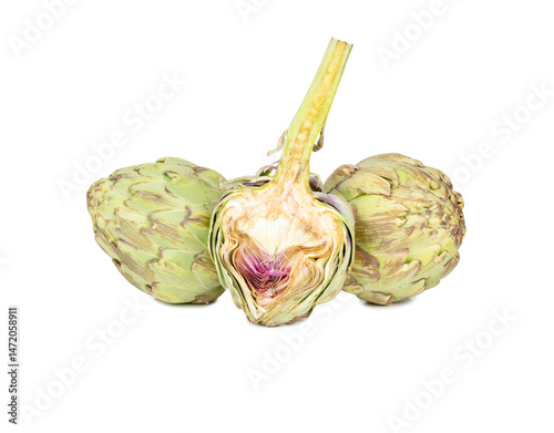 Raw vegetable artichoke with half on a white background