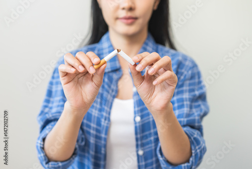 Obraz na plátně Quit, stop smoking, addiction asian young woman, girl refusing cigarette, smoker quitting smoke, hand in broken, break tobacco
