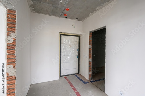 Wallpaper Mural rough repairs for self-finishing. interior decoration, bare walls of the room, stage of construction. interior apartment room. Torontodigital.ca