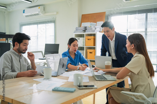 Financial professionals analyzing business data in office meeting, focusing on revenue, budgeting, and long-term success planning performance analysis, investment ideas, and profit growth targets