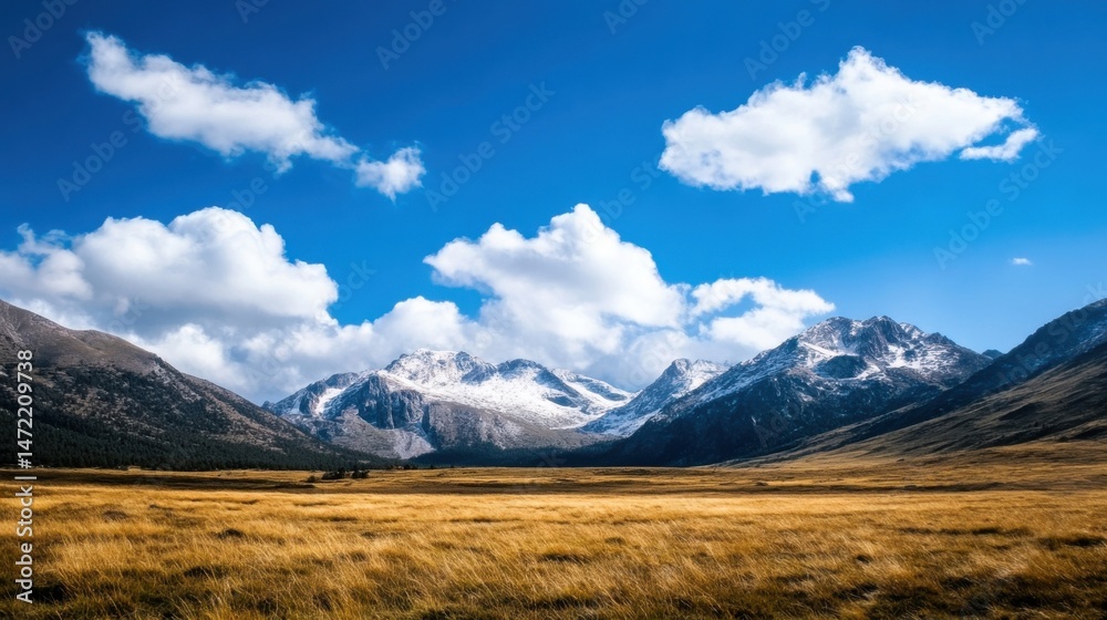 Majestic snow-capped mountains rise above a vast, golden meadow under a vibrant blue sky dotted with fluffy white clouds, creating a breathtaking landscape. : Generative AI Majestic snow-capped mountains rise above a vast, golden meadow under a vibrant blue sky dotted with fluffy white clouds, creating a breathtaking landscape. : Generative AI