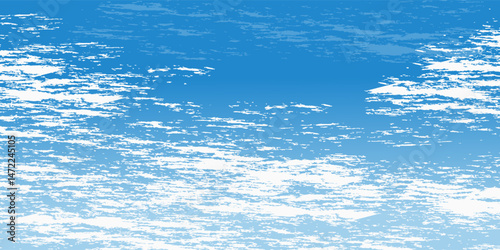clear blue sky with a few clouds. The sky is very bright and the clouds are scattered throughout
