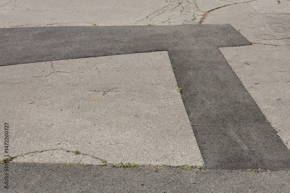 Fototapeta premium asphalt pavement with cracks and patches