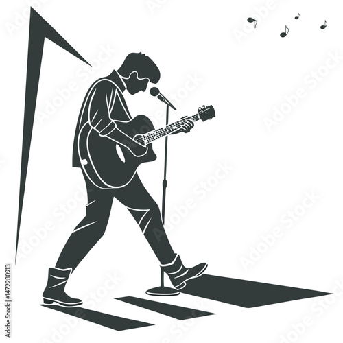 Silhouette of a musician playing acoustic guitar singing into microphone under spotlight