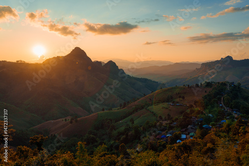 Sunset over local village on mountain in the valley at Gigokor viewpoint photo