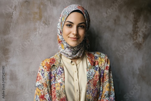 Smiling woman wearing a flo...