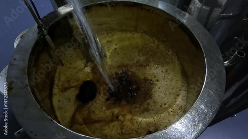Pour water into the product tank at the factory