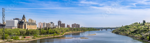 Bild auf Leinwand Wide angle panoramic view of north bank of the river around downtown Saskatoon,