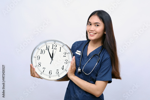 Woman doctor showing clock