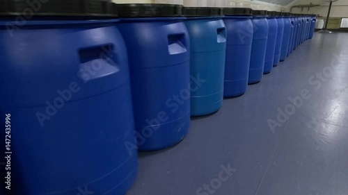 Blue barrels in production. Barrels in the factory slowdown