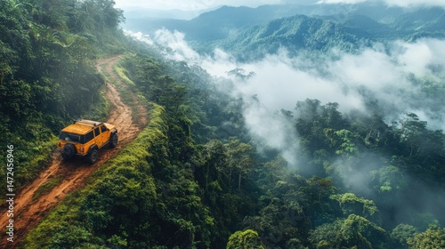 A vehicle on a high road suspended over a dense forest canopy. Quiet exploration, untouched wilderness.