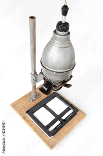 Vintage photographic enlarger for projecting photo negatives, isolated on white background, photo